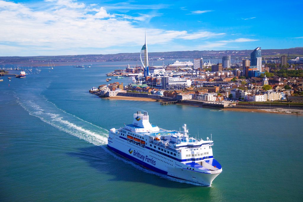 Brittany Ferries ship leaving Portsmouth Harbour past Spinnaker Tower
