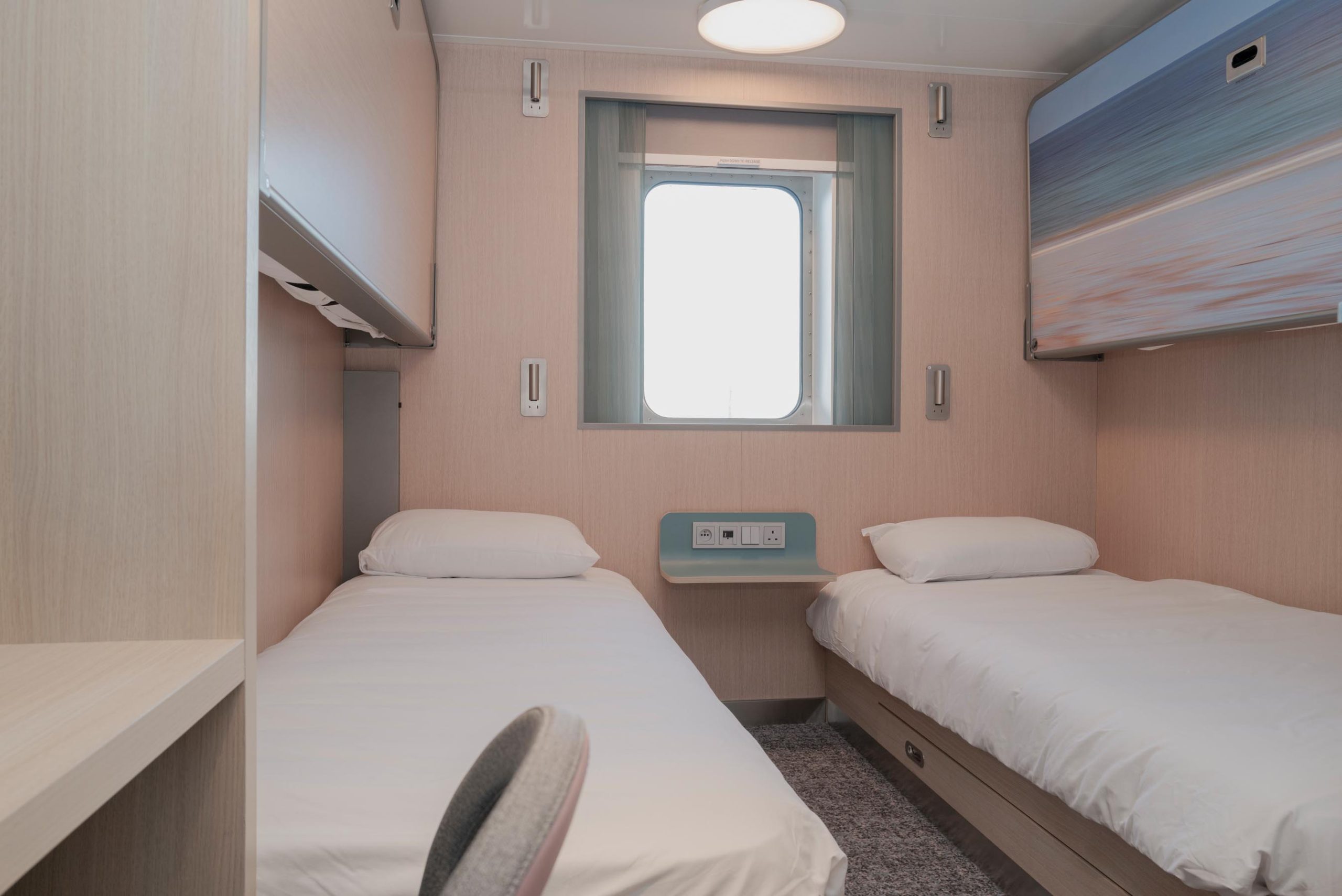 4-berth outside cabin on the MV Saint-Malo with porthole window and bunk-style beds